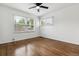 Bright bedroom featuring hardwood floors, two windows and a ceiling fan at 2731 S Pearl St, Englewood, CO 80113