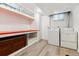 Basement laundry room with storage and a washer/dryer at 2731 S Pearl St, Englewood, CO 80113