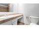 Bathroom featuring a clean vanity with sink, neutral color countertop and toilet at 2101 S Victor St # C, Aurora, CO 80014