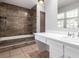 Relaxing bathroom showcasing a tub, shower, and a sink vanity that brings a sense of comfort and cleanliness at 2101 S Victor St # C, Aurora, CO 80014
