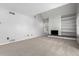 Large living room featuring a white brick fireplace with white built-in shelves at 2101 S Victor St # C, Aurora, CO 80014