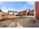 Home exterior displaying a fenced backyard with beautiful gravel landscaping at 11034 Nome St, Commerce City, CO 80640