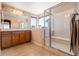 Bathroom featuring a large shower, soaking tub, and neutral decor at 11034 Nome St, Commerce City, CO 80640