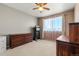 Cozy bedroom with neutral walls, a bright window, and space for workout equipment at 11034 Nome St, Commerce City, CO 80640