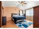 Serene main bedroom with wood floors, a cozy rug, and large windows for natural light at 11034 Nome St, Commerce City, CO 80640