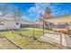 This backyard features a covered patio and landscaping, offering a relaxing outdoor space for entertaining or enjoying nature at 4476 S Lincoln St, Englewood, CO 80113