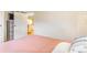 Bright bedroom featuring hardwood floors and a neutral color palette at 4476 S Lincoln St, Englewood, CO 80113