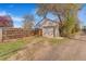 Detached one car garage surrounded by privacy fence with additional off-street parking at 4476 S Lincoln St, Englewood, CO 80113