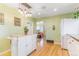 Spacious kitchen with bright white cabinets and a butcher block island at 4476 S Lincoln St, Englewood, CO 80113