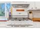 Kitchen features a white range, butcher block countertop, and a subway tile backsplash at 4476 S Lincoln St, Englewood, CO 80113