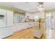 Bright, airy kitchen featuring white cabinets, butcher block counters, and stainless appliances at 4476 S Lincoln St, Englewood, CO 80113