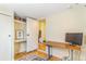 Home office featuring a built-in desk and storage with a light hardwood floor at 4476 S Lincoln St, Englewood, CO 80113