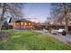 Landscaped backyard with fire pit and seating area at 4030 Lowell Blvd, Denver, CO 80211