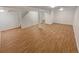 Spacious basement featuring wood style flooring and support beams at 3986 S Bahama St, Aurora, CO 80013