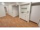 Basement with a sink, cabinets, and a full sized refrigerator at 3986 S Bahama St, Aurora, CO 80013