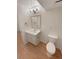 Bright bathroom with white vanity, modern lighting, and neutral colored flooring at 3986 S Bahama St, Aurora, CO 80013