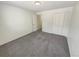 Carpeted bedroom featuring a standard closet and overhead lighting at 3986 S Bahama St, Aurora, CO 80013