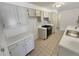 Kitchen with white cabinets, quartz countertops, and stainless steel range at 3986 S Bahama St, Aurora, CO 80013