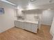Well lit laundry room with vinyl flooring, utility sink, and washer/dryer hookups at 3986 S Bahama St, Aurora, CO 80013