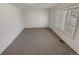 Neutral room featuring plush carpet, white walls, and lots of natural light at 3986 S Bahama St, Aurora, CO 80013