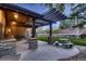 Backyard patio, perfect for outdoor dining and entertaining with stone accents at 9552 E Silent Hills Pl, Lone Tree, CO 80124