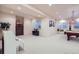 Finished basement with neutral carpet, pool table, white piano, and several windows for natural light at 9552 E Silent Hills Pl, Lone Tree, CO 80124