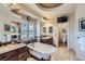 Elegant bathroom with double vanities, a luxurious soaking tub, granite counters and tile flooring at 9552 E Silent Hills Pl, Lone Tree, CO 80124
