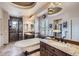 Beautiful bathroom features a soaking tub, granite counters, double sinks and a glass enclosed shower at 9552 E Silent Hills Pl, Lone Tree, CO 80124