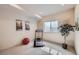 Bright exercise room with treadmill, natural light, and ample space for a home gym setup at 9552 E Silent Hills Pl, Lone Tree, CO 80124