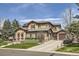 Stately home boasting meticulous landscaping, a circular driveway, and a grand entrance at 9552 E Silent Hills Pl, Lone Tree, CO 80124