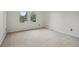 A secondary bedroom features plush carpeting and a bright sunny window at 10849 E Crestridge Cir, Englewood, CO 80111