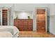 A closet system is conveniently built into this bedroom with a granite top built in dresser at 10849 E Crestridge Cir, Englewood, CO 80111