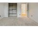 This secondary bedroom is carpeted and features a closet with shelving for storage at 10849 E Crestridge Cir, Englewood, CO 80111