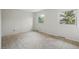 Bright bedroom with neutral carpet, two windows, and clean white walls at 10849 E Crestridge Cir, Englewood, CO 80111