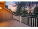 Exterior shot of a well-maintained deck, offering a relaxing space with views of the surrounding greenery and a beautiful sunset at 10849 E Crestridge Cir, Englewood, CO 80111
