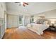 Comfortable main bedroom featuring multiple closets, windows and access to a private balcony at 10849 E Crestridge Cir, Englewood, CO 80111