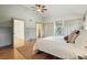 This main bedroom boasts wood floors, neutral colors and direct access to a private balcony at 10849 E Crestridge Cir, Englewood, CO 80111