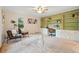 Bright home office featuring built-in shelving and cabinets, a comfortable workspace, and neutral carpets at 10849 E Crestridge Cir, Englewood, CO 80111