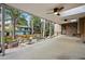 Covered patio featuring ceiling fans, a fire pit, and ample seating for outdoor relaxation and entertainment at 10849 E Crestridge Cir, Englewood, CO 80111