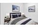 This bedroom features mountain themed decorations and comfortable furnishings at 3818 W 14Th Ave, Denver, CO 80204