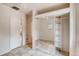 Spacious bedroom with mirrored closet, ceiling fan, and neutral tile flooring at 3818 W 14Th Ave, Denver, CO 80204