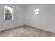 Bright, minimalist bedroom with tile floors, two windows, and ample space at 3818 W 14Th Ave, Denver, CO 80204