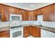 Updated kitchen boasts stainless steel appliances, granite countertops, and sleek cabinetry at 3818 W 14Th Ave, Denver, CO 80204