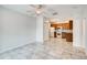 Open-concept kitchen with tile flooring, stainless steel appliances, and wooden cabinetry at 3818 W 14Th Ave, Denver, CO 80204