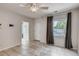 Neutral toned room with tile flooring, ceiling fan, and modern window treatments at 3818 W 14Th Ave, Denver, CO 80204