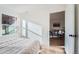 A sunlit bedroom shows the entrance to the living room at 4294 S Salida Way # 4, Aurora, CO 80013