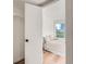 View of bedroom with wood floors, bedside table, and window at 4294 S Salida Way # 4, Aurora, CO 80013