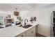 Bright kitchen featuring a breakfast bar open to the living room and a view of the fireplace at 4294 S Salida Way # 4, Aurora, CO 80013