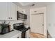 Efficient kitchen layout with sleek appliances and ample cabinet space next to a closet at 4294 S Salida Way # 4, Aurora, CO 80013