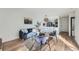 Stylish living room with modern seating, adjacent to an open-concept kitchen with bar seating at 4294 S Salida Way # 4, Aurora, CO 80013